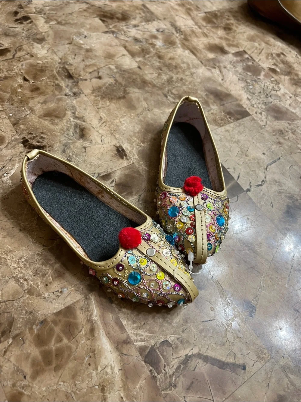 Embellished Gold kid Flats with Red Pom-Pom